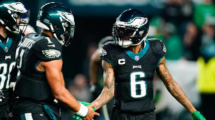 Eagles wide receiver DeVonta Smith, right, celebrates after scoring with quarterback Jalen Hurts on Christmas Day 2023